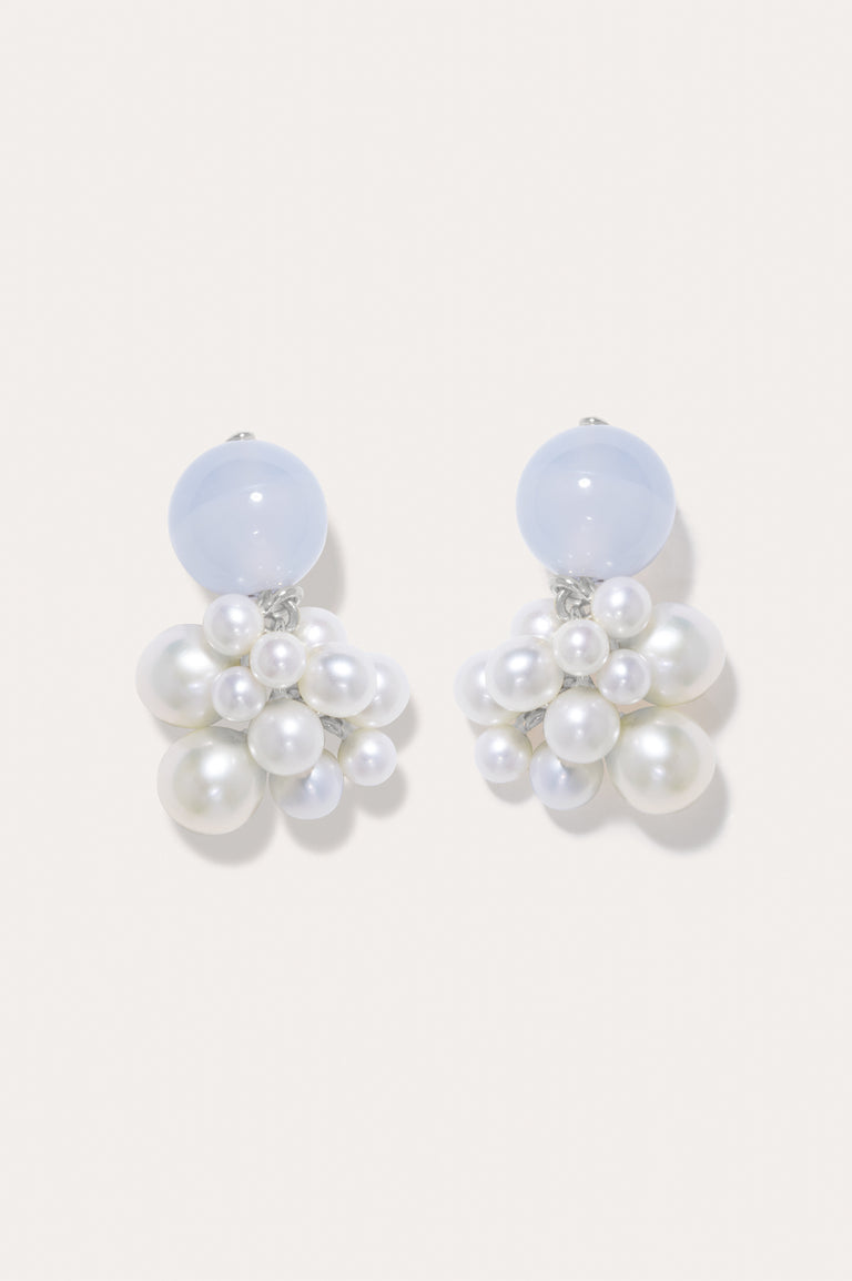 A pair of earrings featuring pearl and blue lace agate with recycled silver.