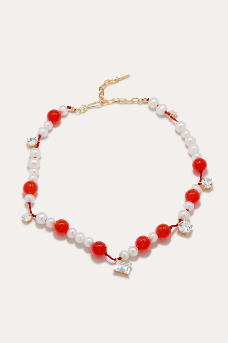 Une série de perturbations mineures – Collier en vermeil d’or recyclé avec perle, zircon et quartz orange