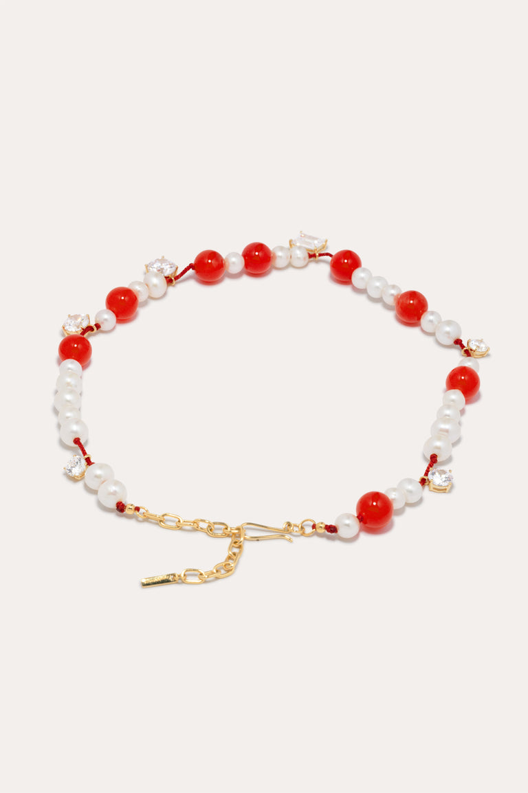 Une série de perturbations mineures – Collier en vermeil d’or recyclé avec perle, zircon et quartz orange