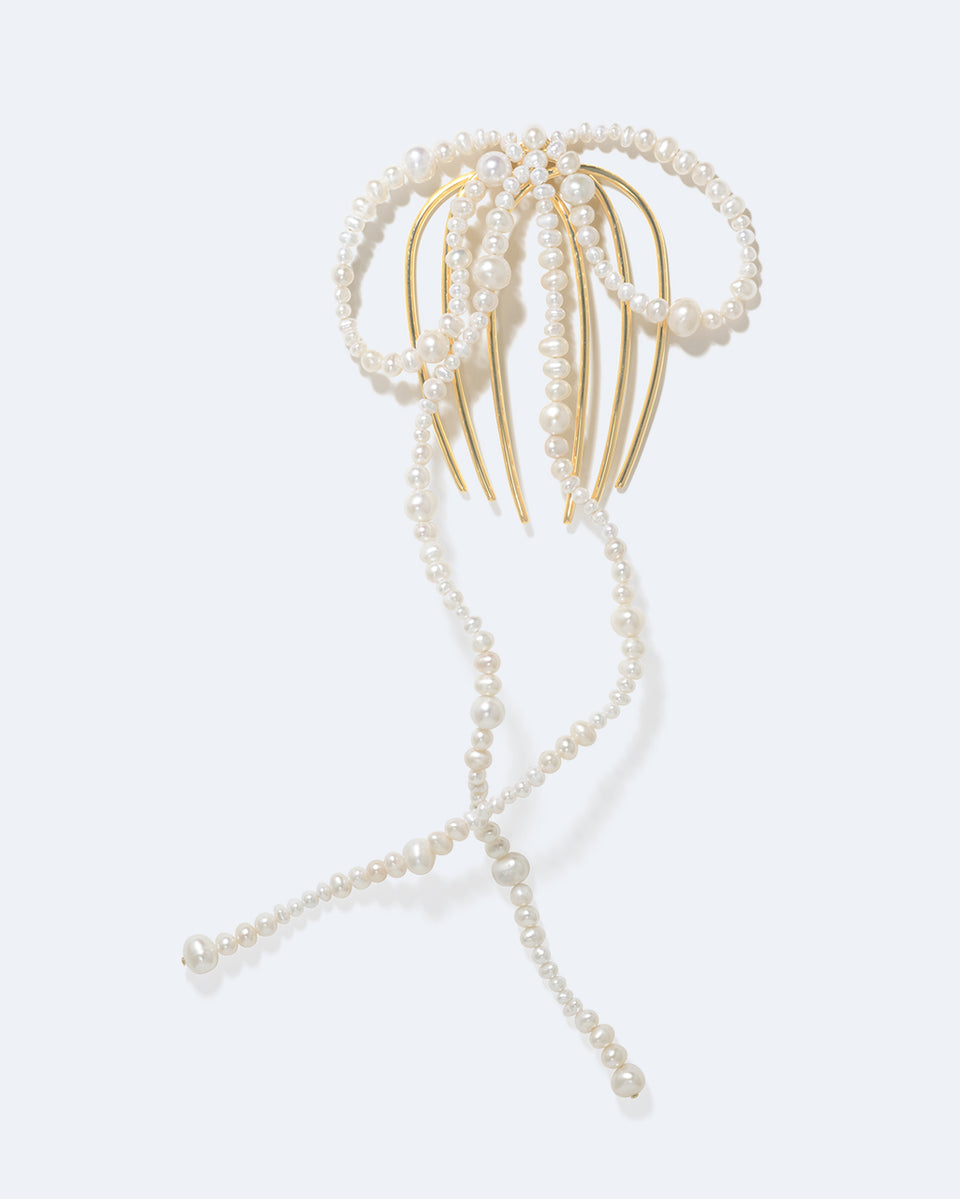 P189 - Peigne à cheveux long orné d'un nœud en perles et plaqué or