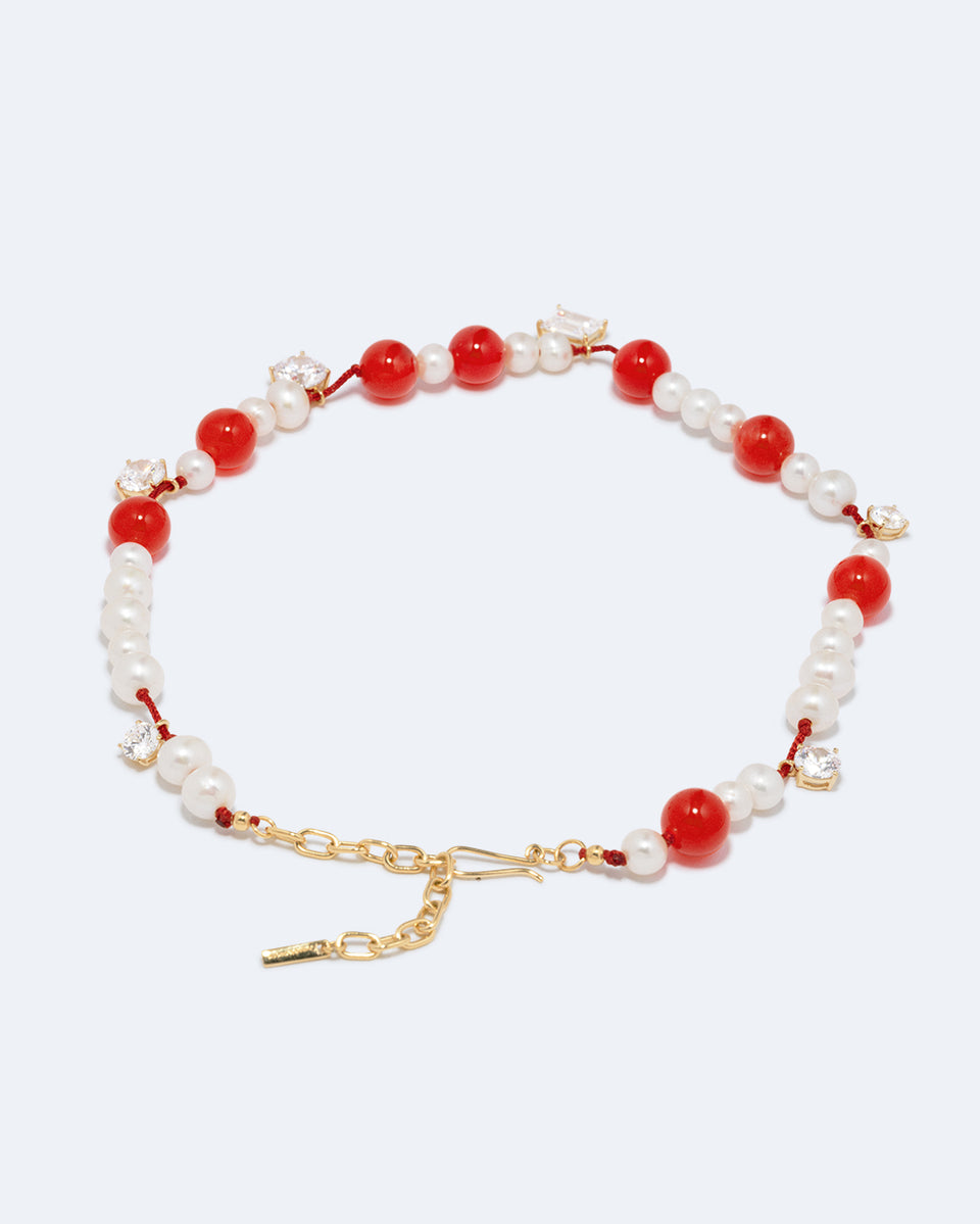 Une série de perturbations mineures – Collier en vermeil d’or recyclé avec perle, zircon et quartz orange